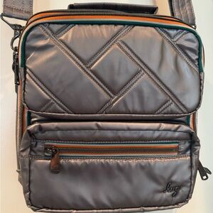 Lug- Crossbody with top handle.  Like new!  Gun metal metallic